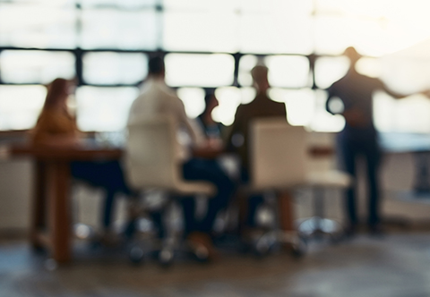 Blurred photo of people at a table