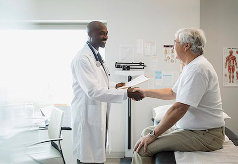 Doctor shaking hands with a patient