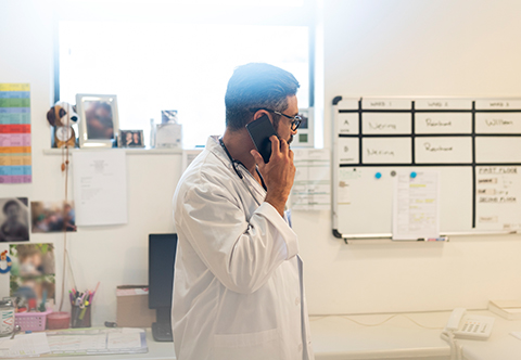 Physician speaking on a cellphone