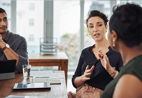 A group of people engaged in a serious discussion